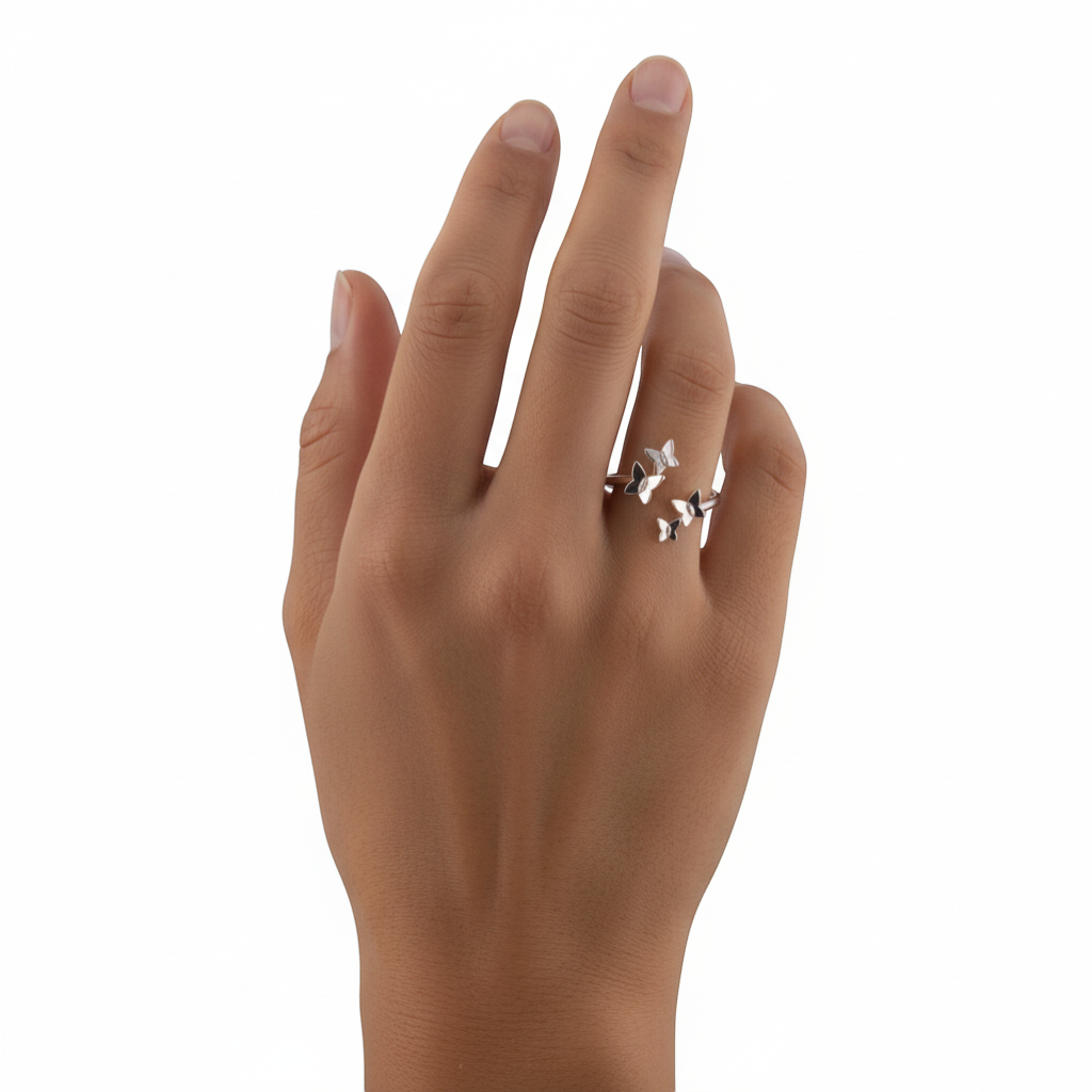 Adjustable sterling silver ring with a cluster of small butterflies, designed to wrap around the finger.